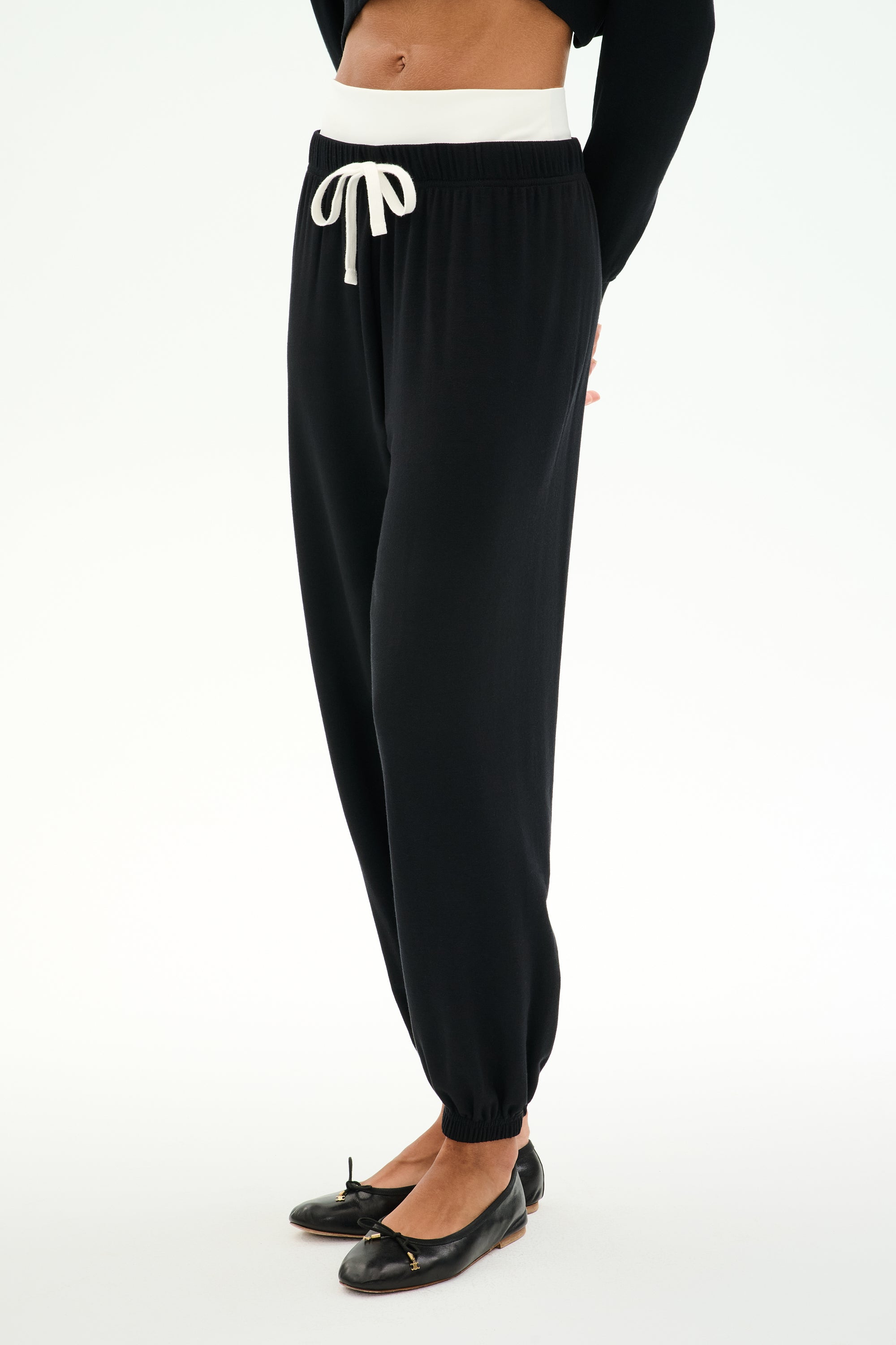 Official SPLITS59 image of the Andie Dual Waist Sweatpant in black with a contrasting waistband